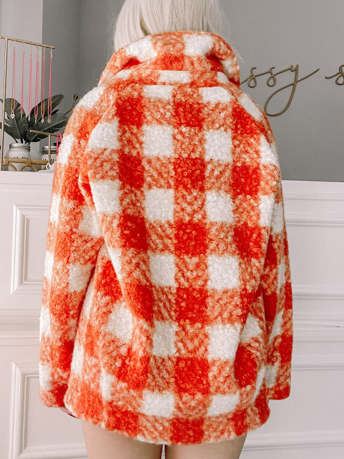 Red and white gingham sherpa jacket, back view.
