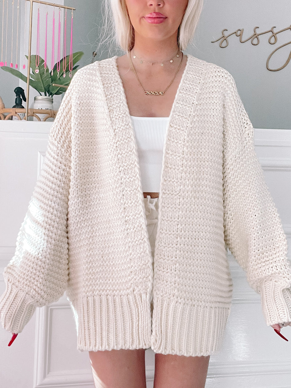 Cream Spring Shine Cardigan: chunky knit, oversized fit, open front.
