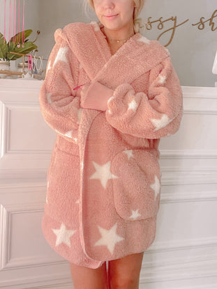 Pink fuzzy Starburst jacket with white stars

