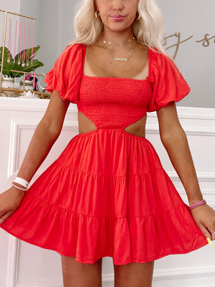 Red Clementine Cutie dress: tiered mini dress with cutout detail.

