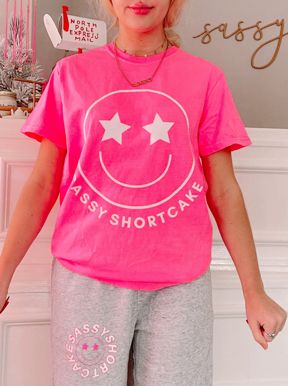 Pink Sassy Shortcake tee with smiley face and star eyes graphic

