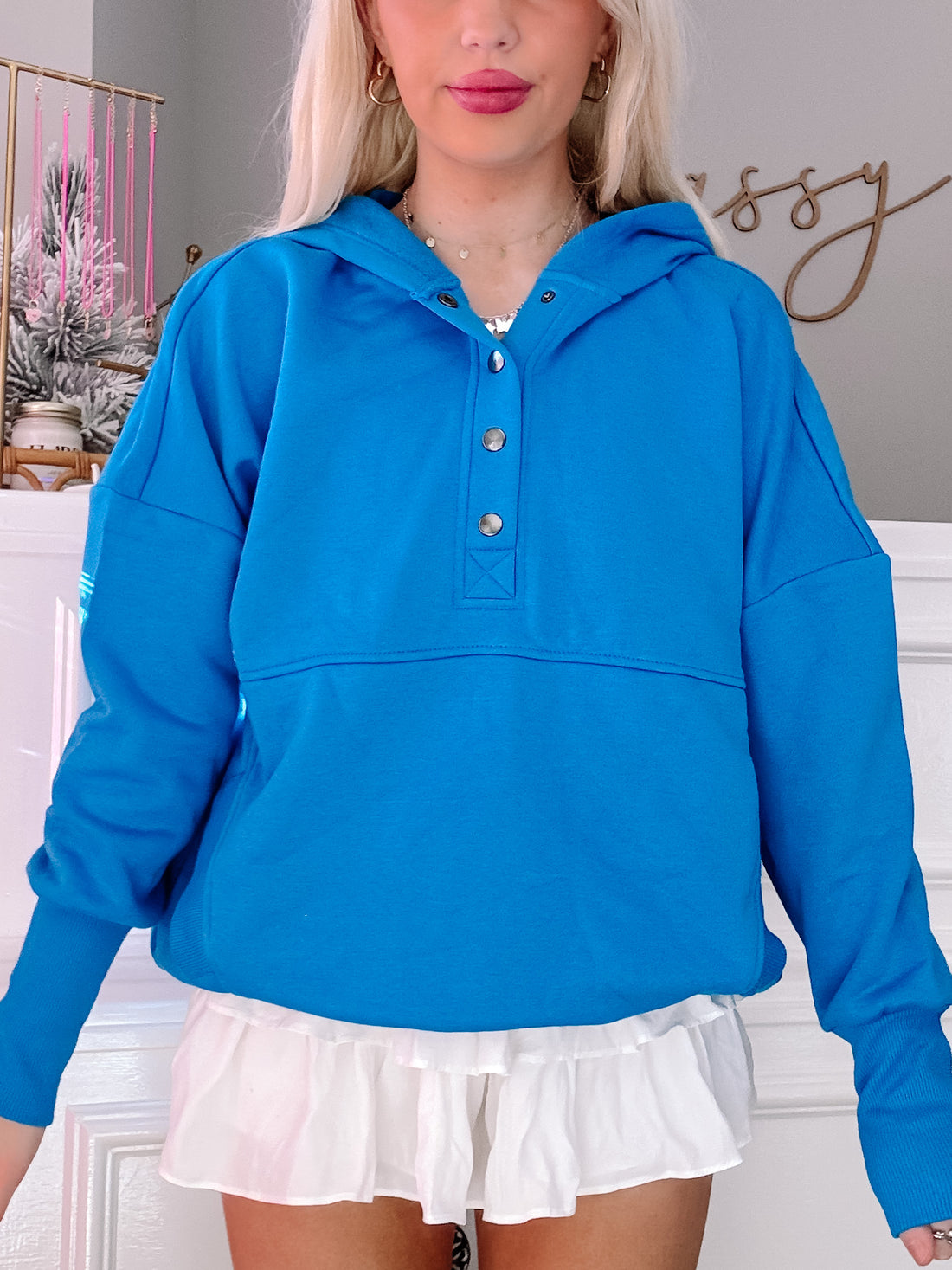 Lana Pullover in bright blue, featuring a relaxed fit and button placket.
