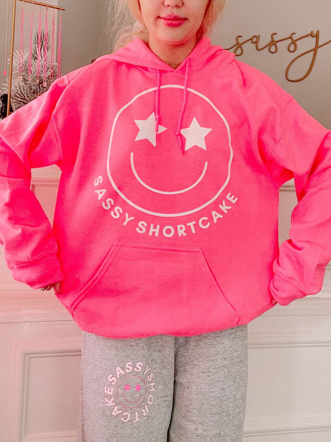 Hot pink Sassy Shortcake smiley hoodie with white star eyes
