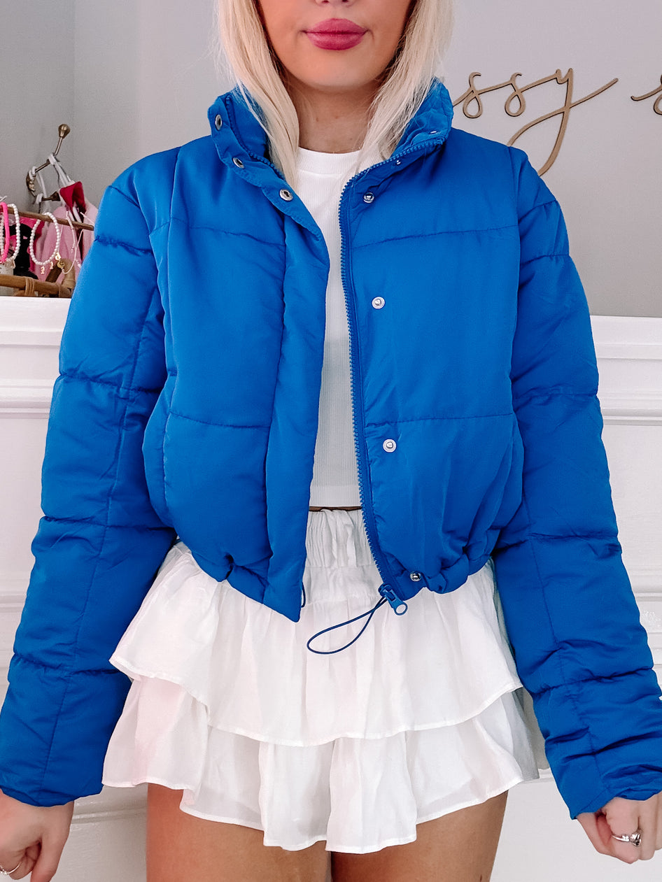 Candyland Puffer Jacket in bright blue, cropped fit.
