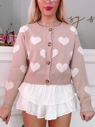 Mocha Love Cardigan: Blush pink knit cardigan adorned with fluffy white hearts, perfect for a romantic look.
