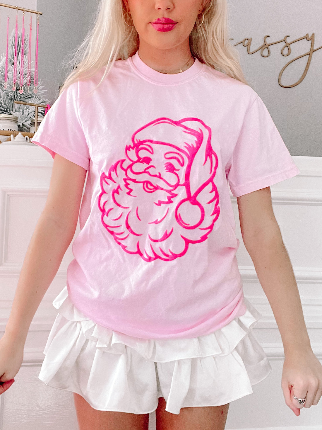 Neon pink Santa tee featuring a retro Santa graphic from sassy shortcake
