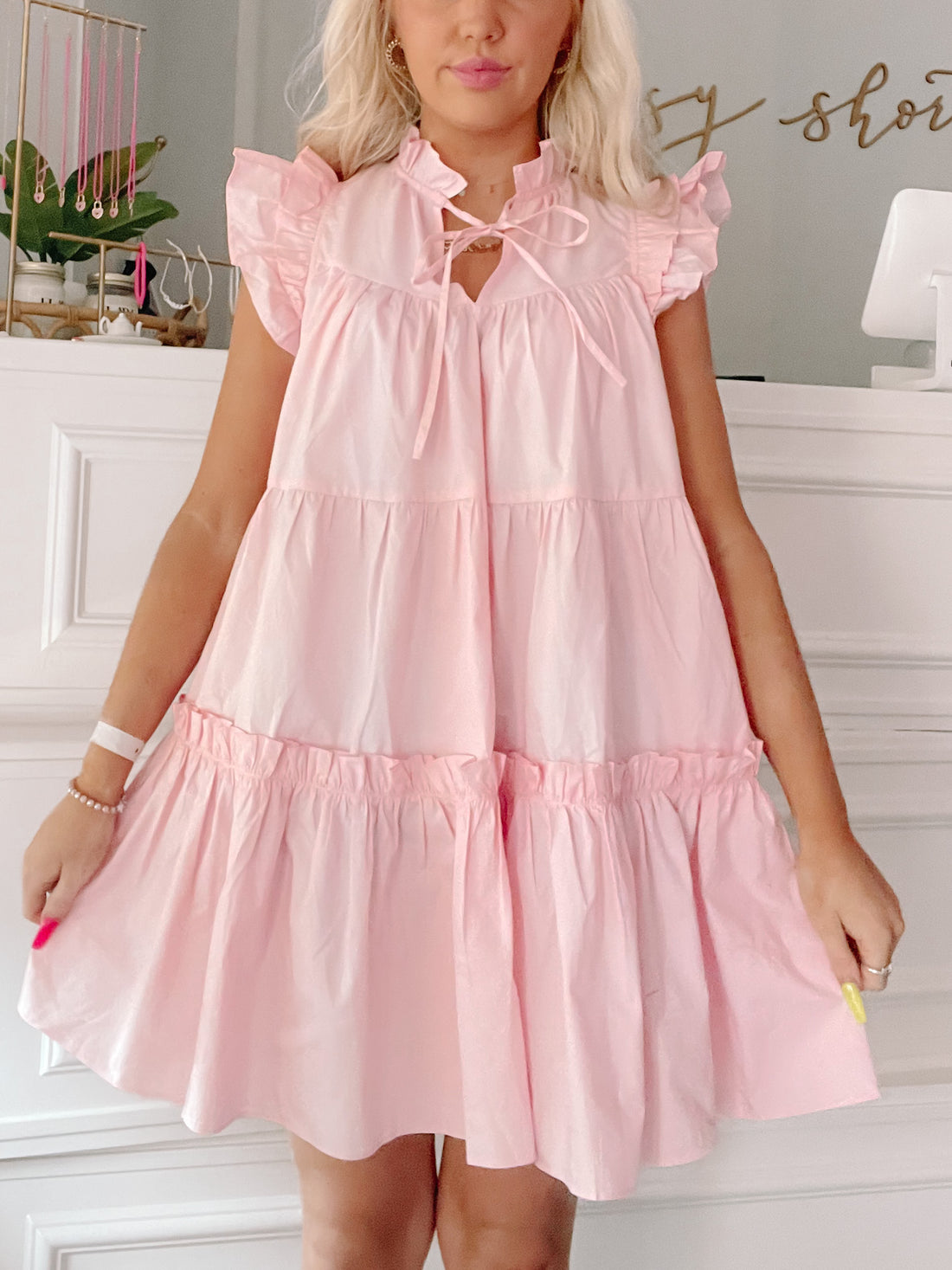 Pink tiered ruffle mini dress with a keyhole neckline
