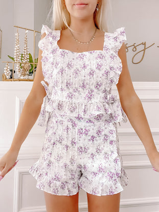 Linen Lilac Set: White and purple floral linen crop top and shorts set with ruffle trim.
