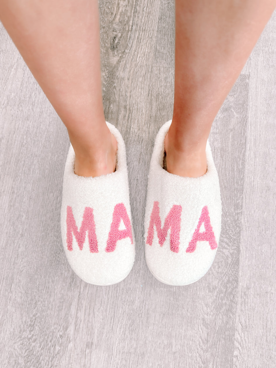 White Mama slippers with pink lettering for ultimate comfort.
