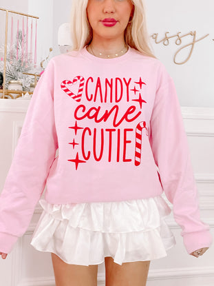 Pink Candy Cane Cutie crewneck sweatshirt with red candy cane and sparkle graphic
