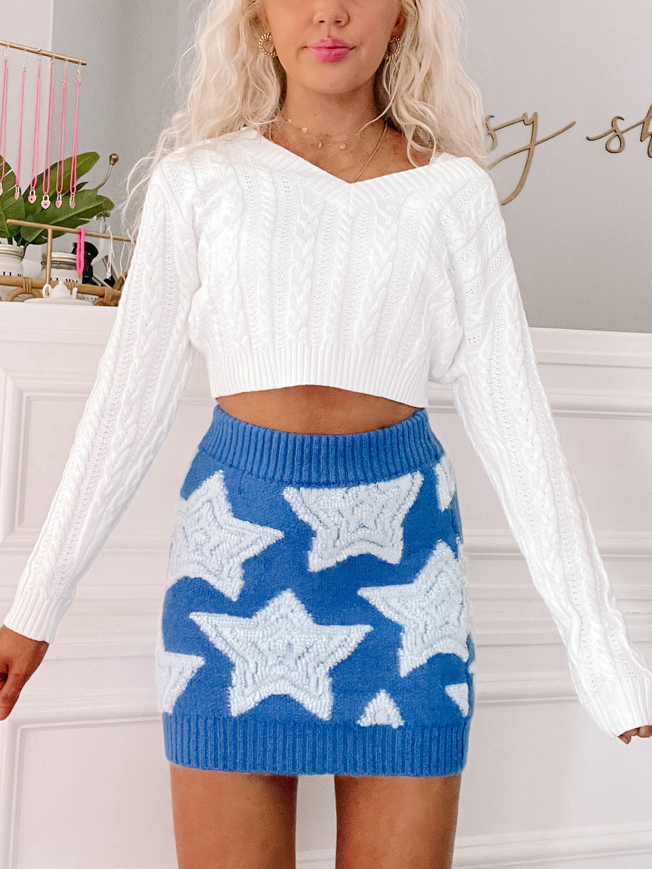 Twilight Twinkle star-patterned mini skirt in blue with white stars.

