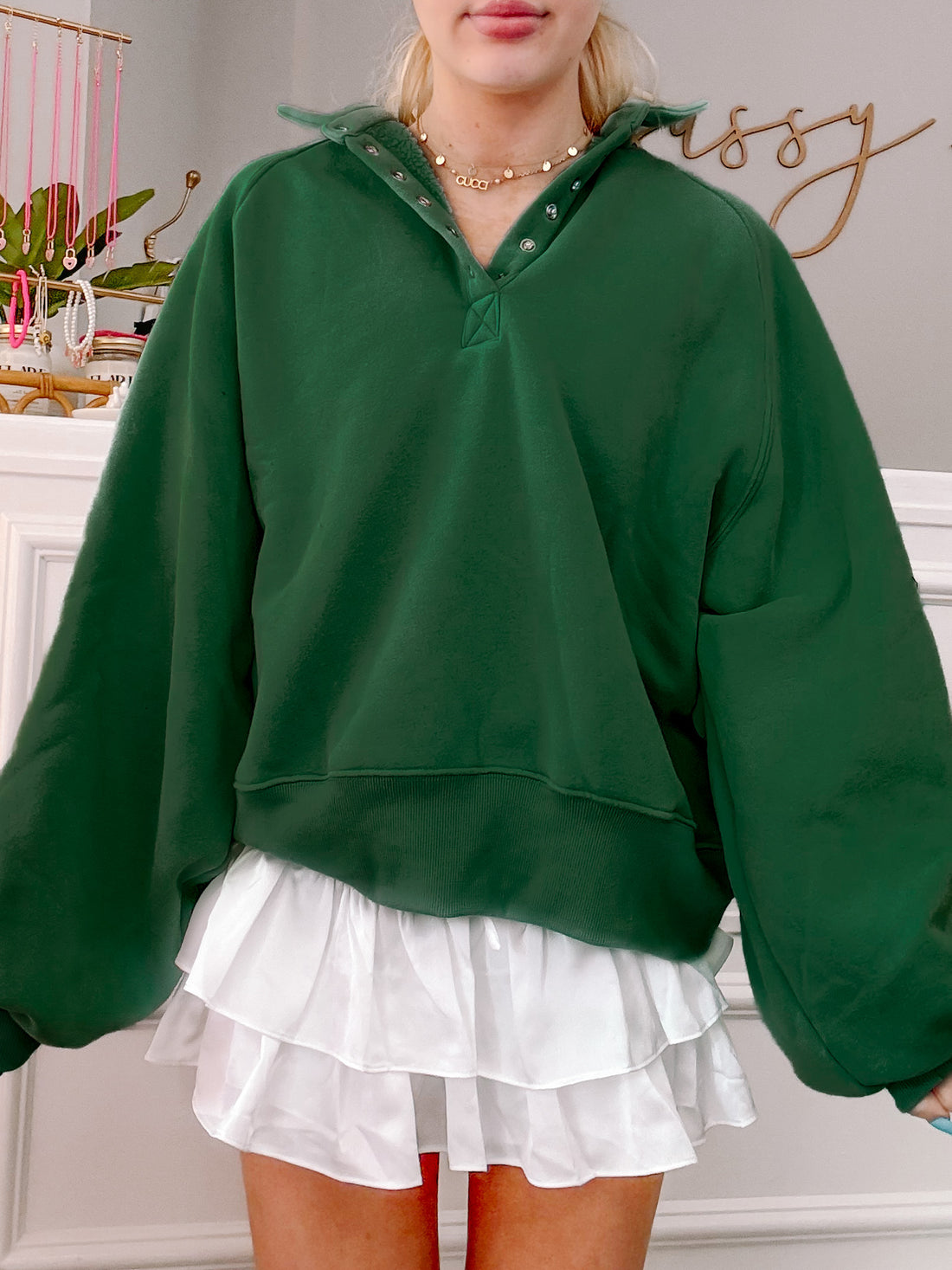 Hunter green Brynn pullover top with button placket and balloon sleeves.
