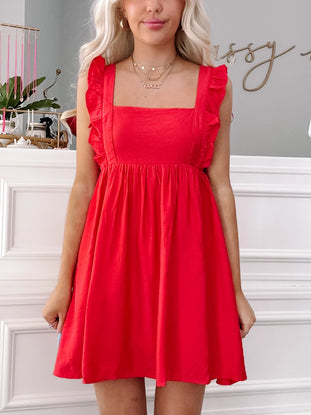 Red Ruby Ruffles mini dress with square neck and ruffle detailing.
