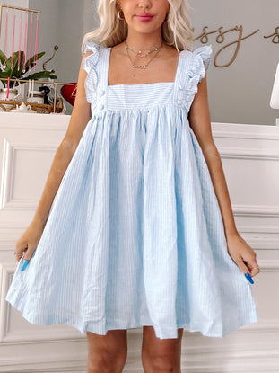 Light blue striped mini dress with ruffle sleeves, shown on a model.
