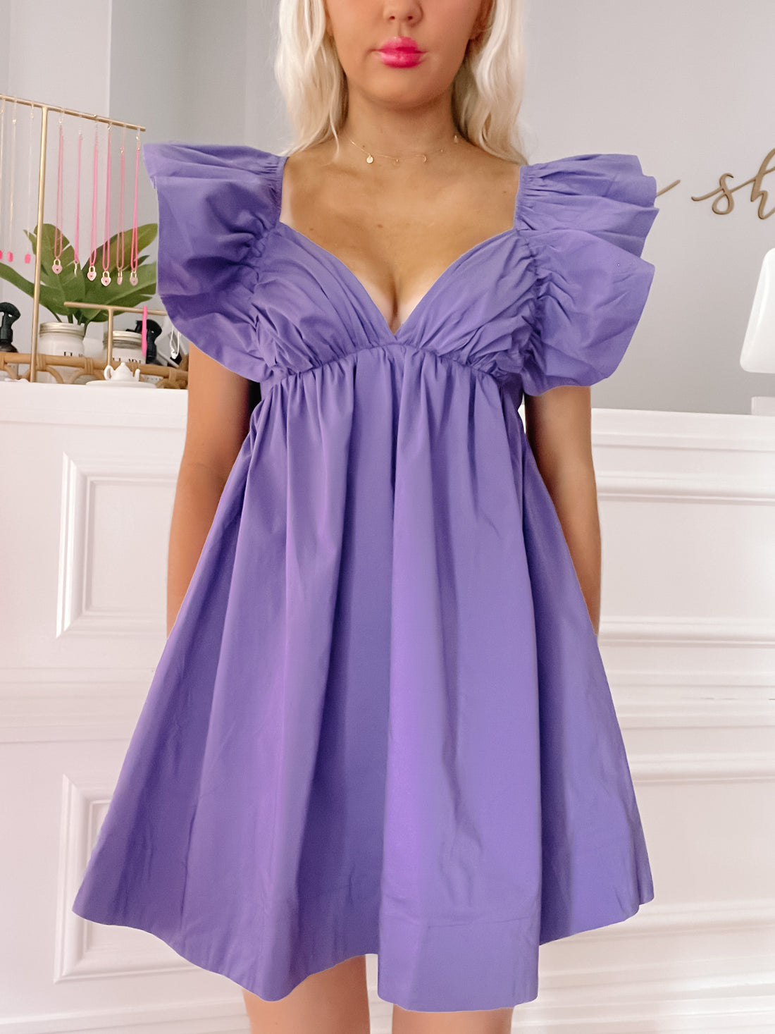 Purple Cabo Cutie dress with ruffled sleeves and V-neck.
