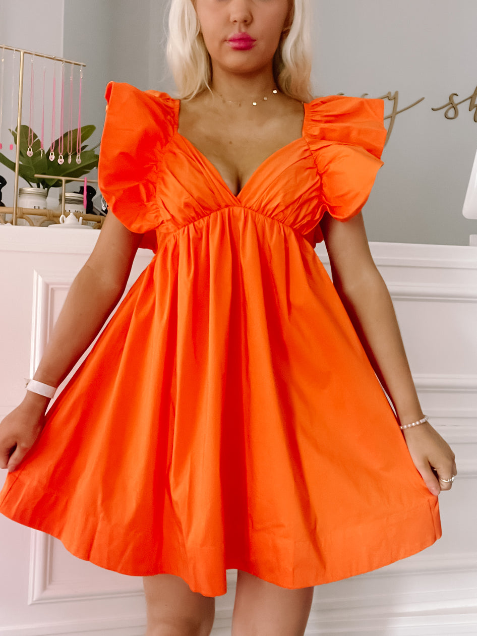 Orange Cabo Cutie Dress:  bright, flirty mini dress with ruffle sleeves.
