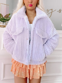 Lavender plush teddy jacket, button closure, shown on model.
