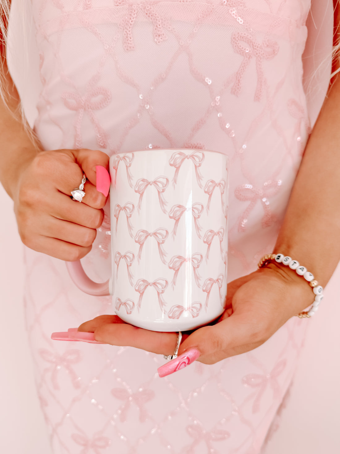 Mini Bow Mug:  Pink bow pattern ceramic mug with pink handle.
