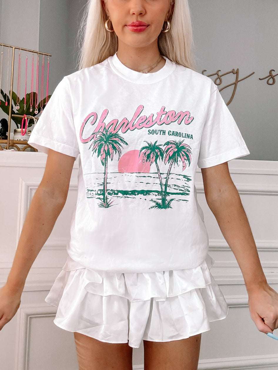 White Charleston Tee featuring palm tree and sunset graphic; South Carolina.
