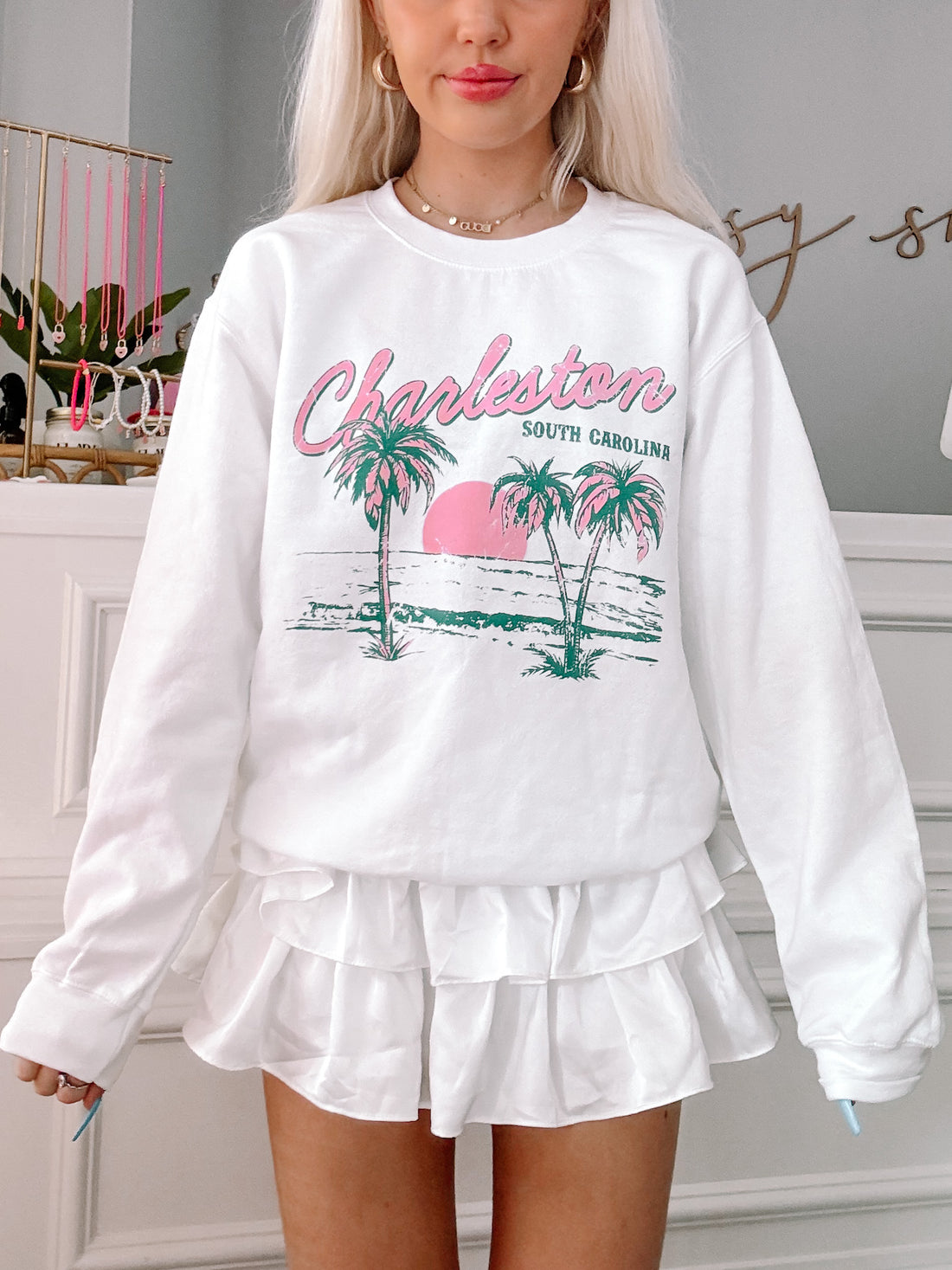White Charleston crewneck sweatshirt with palm tree graphic; South Carolina design.
