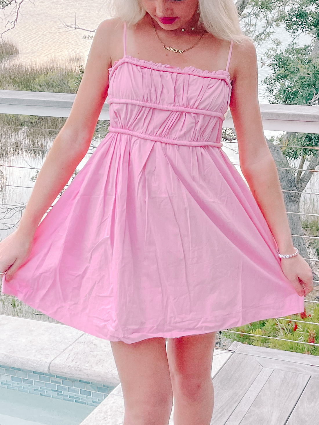 Pink summer dress, ruched bodice, A-line skirt, perfect for summer events.
