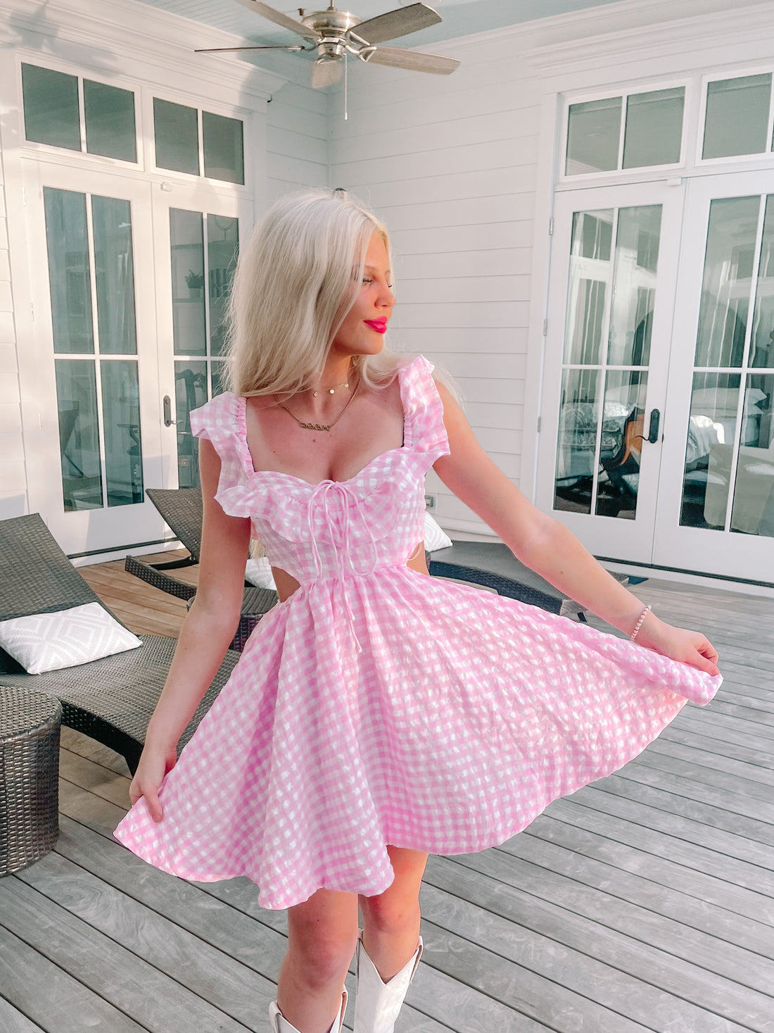 Pink gingham dress outdoors, cut-out detail, summer fashion
