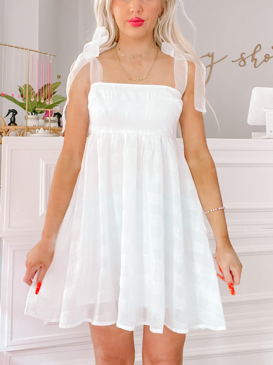 White eyelet mini dress with sheer shoulder ties
