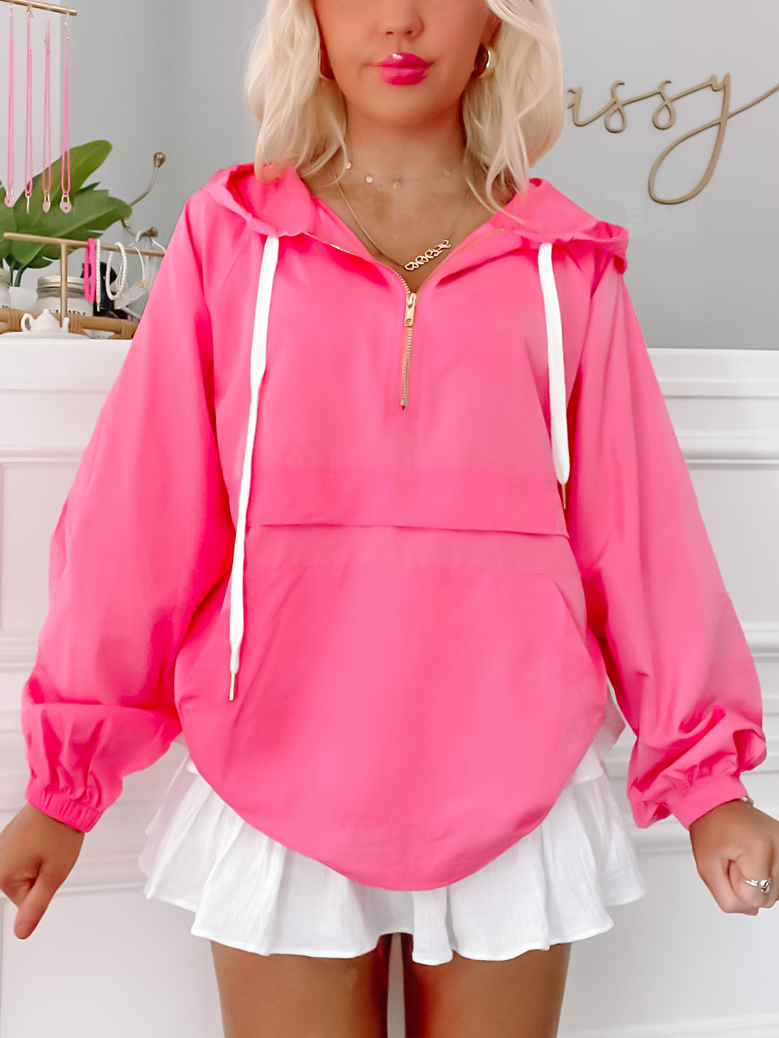 Pink Pacer Windbreaker: Hot pink, lightweight jacket with white drawstrings and gold zipper.
