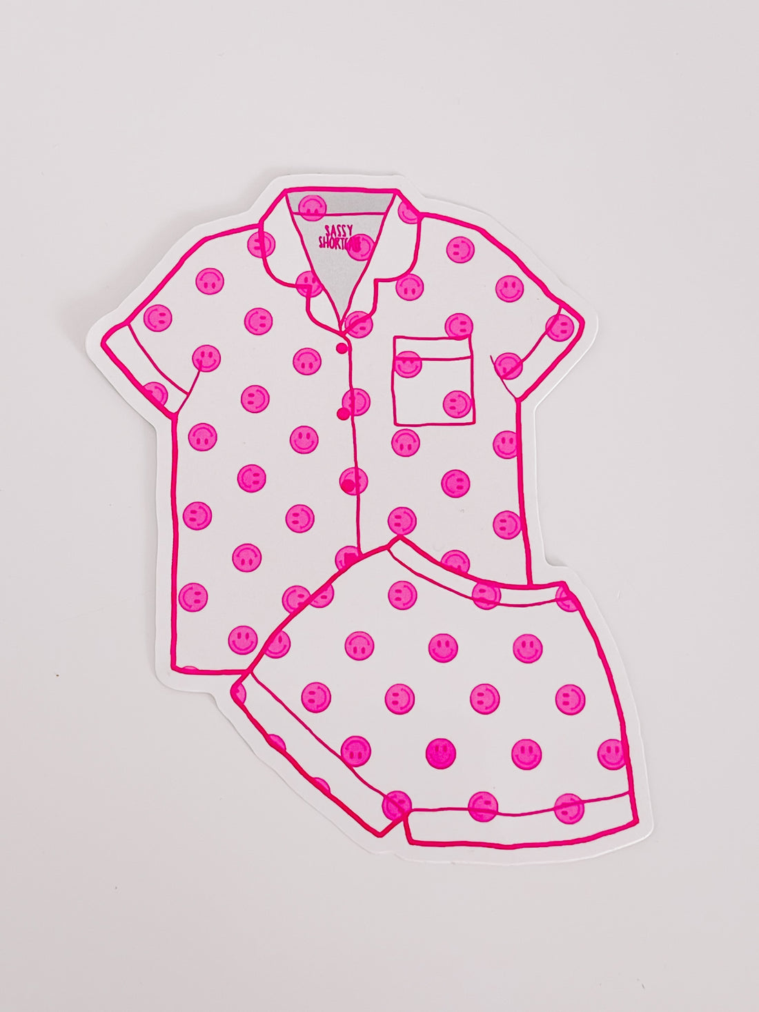 Pink smiley face pajama sticker sheet; fun, playful design.

