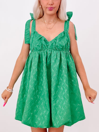 Emerald green floral Just My Luck dress with tie straps.

