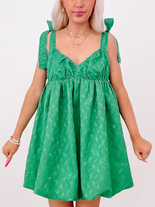 Emerald green floral Just My Luck dress with tie straps.
