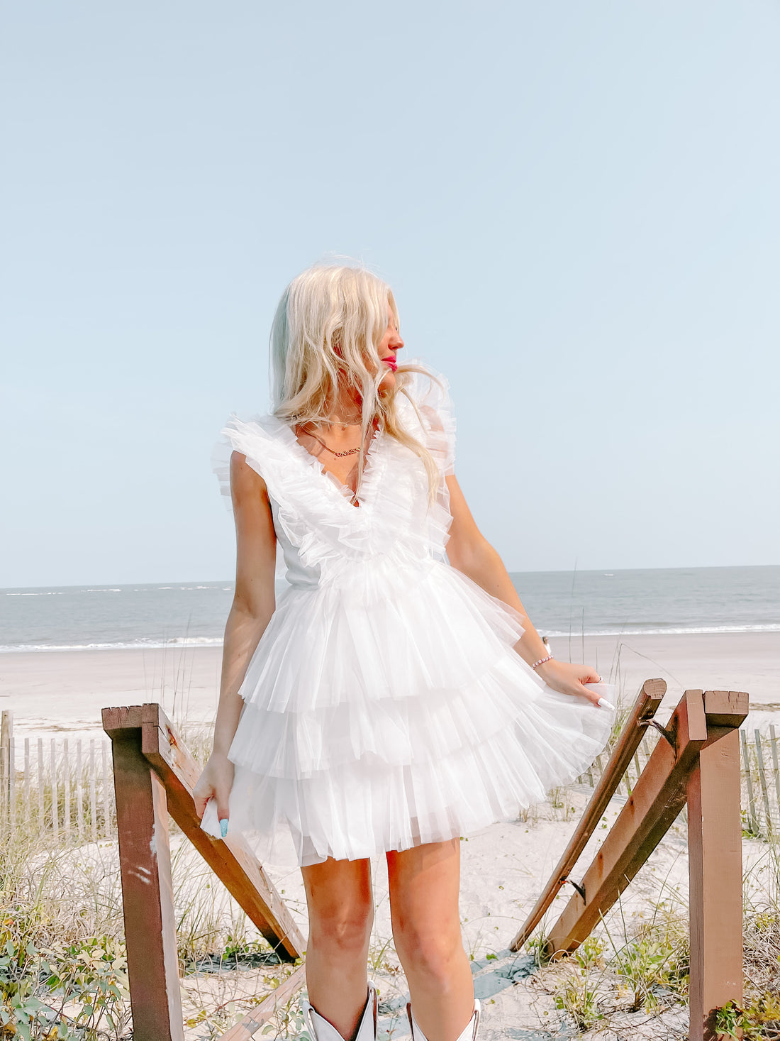 White Tulle Good to Be True dress: tiered, ruffled mini dress for beach weddings.
