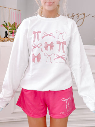 Pink Sassy Shortcake shorts with bow graphic; comfy, cute & casual.
