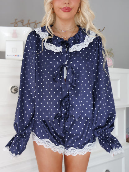 Navy satin lounge set with polka dots and lace trim shown on model standing casually from Sassy Shortcake