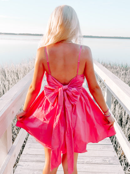 Pink Bow Tide dress with large back bow detail.
