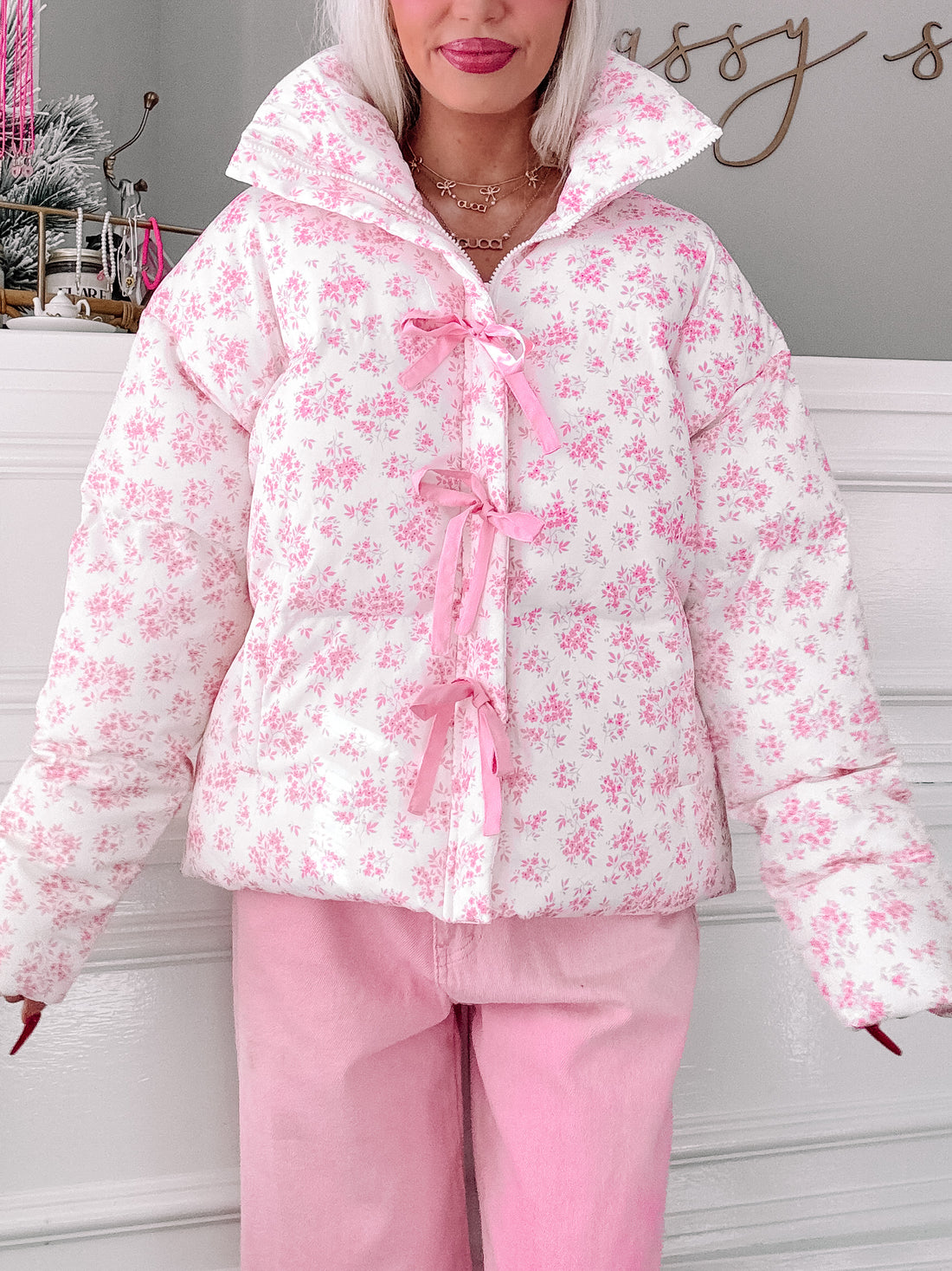 Blossom Bow Jacket: Pink floral puffer jacket with ribbon details.
