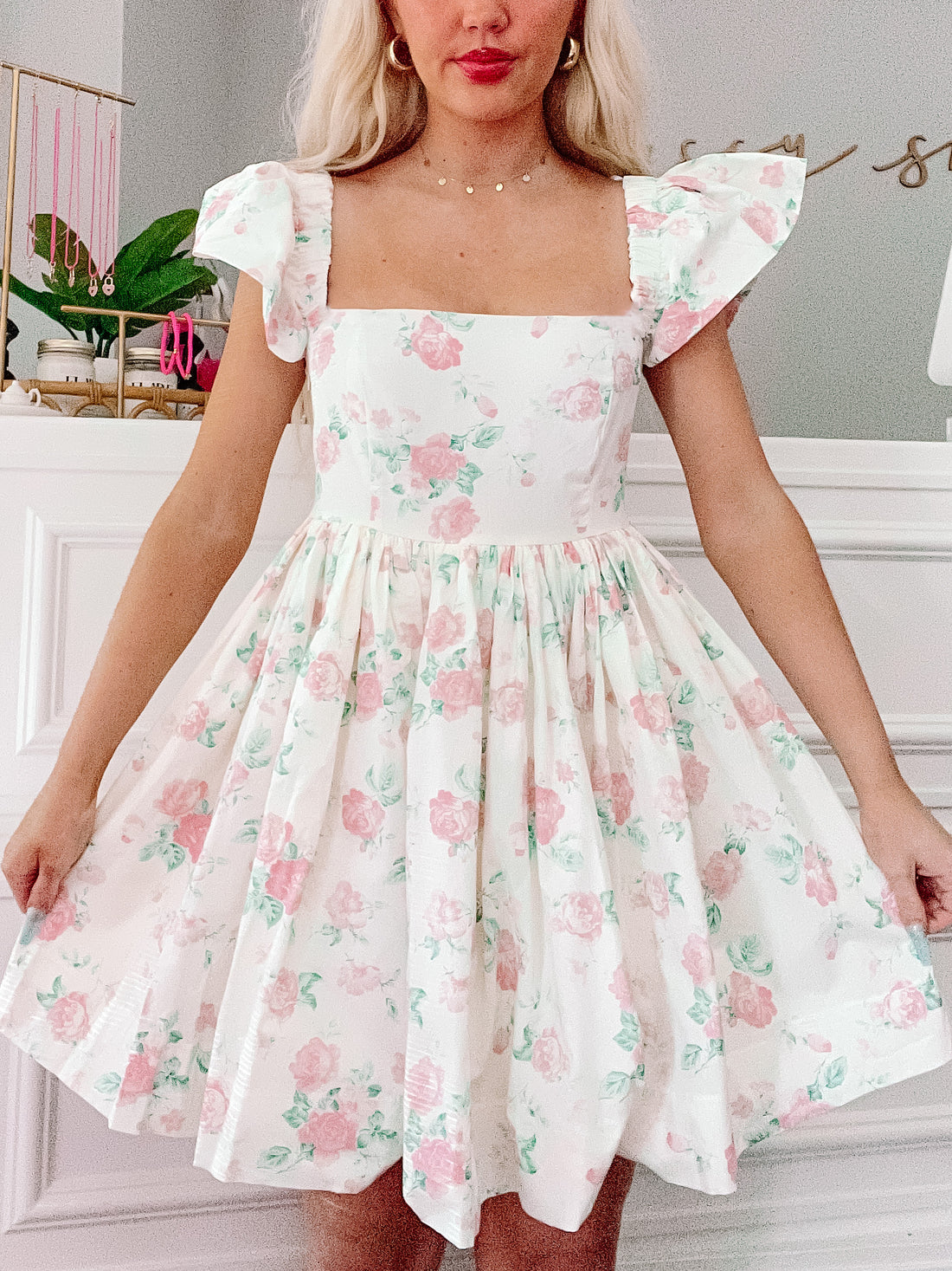 Floral Rosette dress with puff sleeves and a fit-and-flare silhouette.
