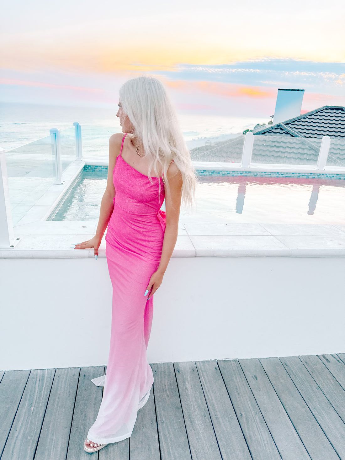 Pink ombre maxi dress by the pool at sunset.

