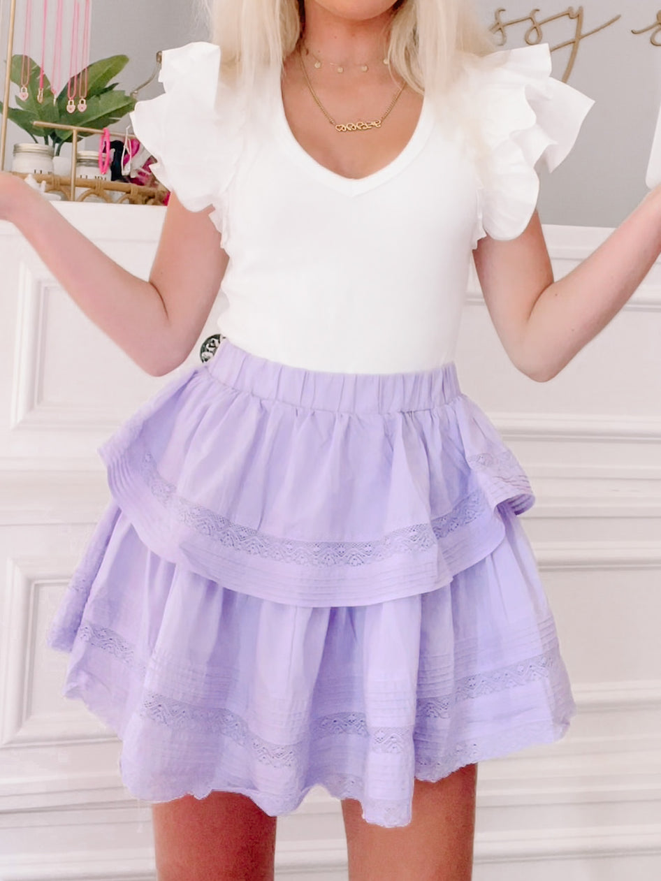 Lilac Story of Us tiered ruffle mini skirt with delicate lace trim.
