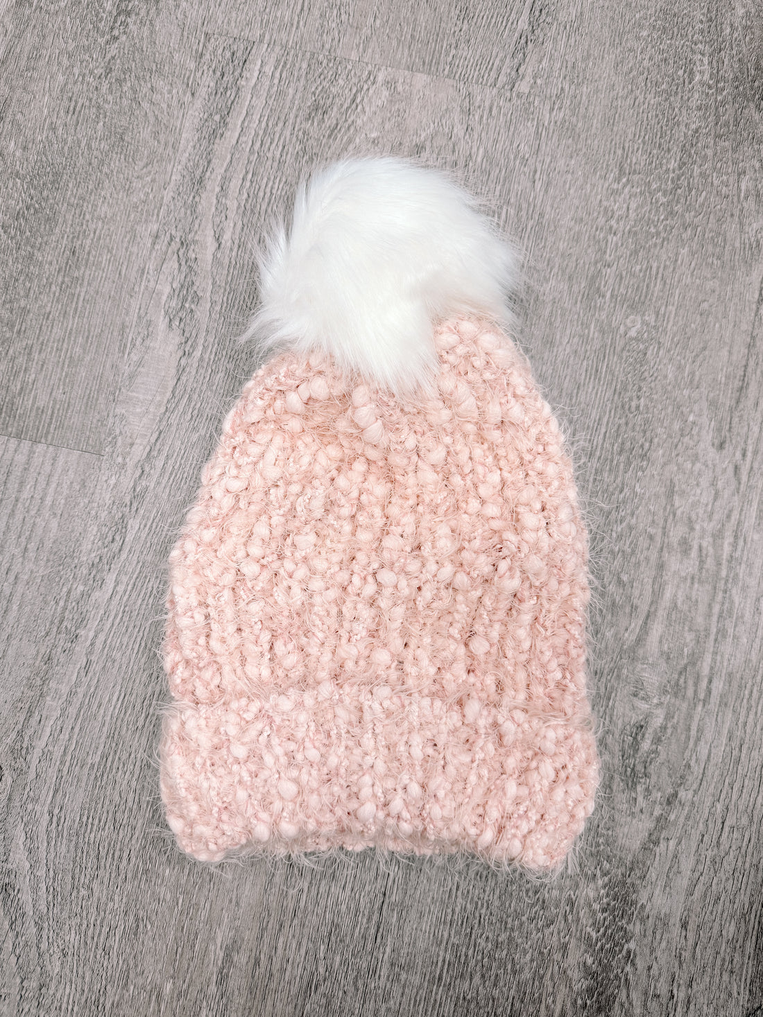 PFS Beanie #1: Pink fuzzy beanie with white pompom, perfect for winter warmth.
