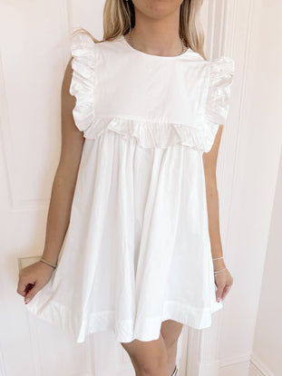 White cotton Debut Darling dress with ruffle details
