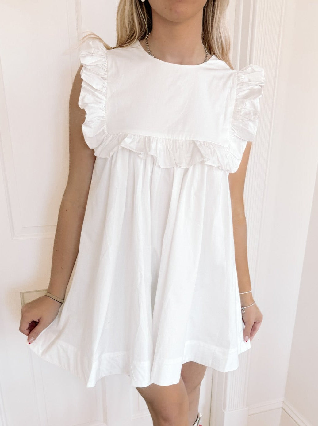 White cotton Debut Darling dress with ruffle details
