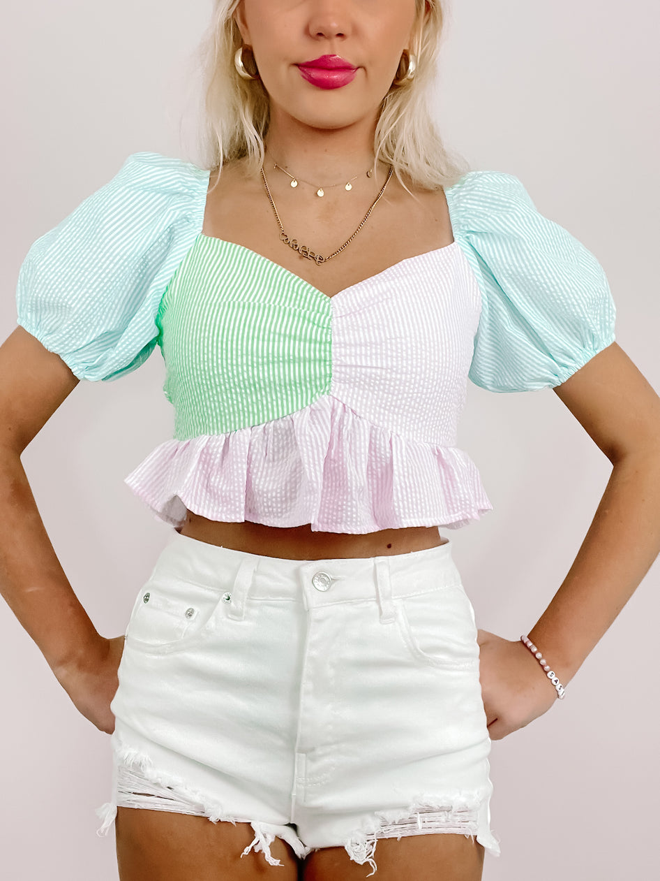 Sweet Seersucker puff-sleeve crop top in pastel green, pink, and mint;  sweetheart neckline.

