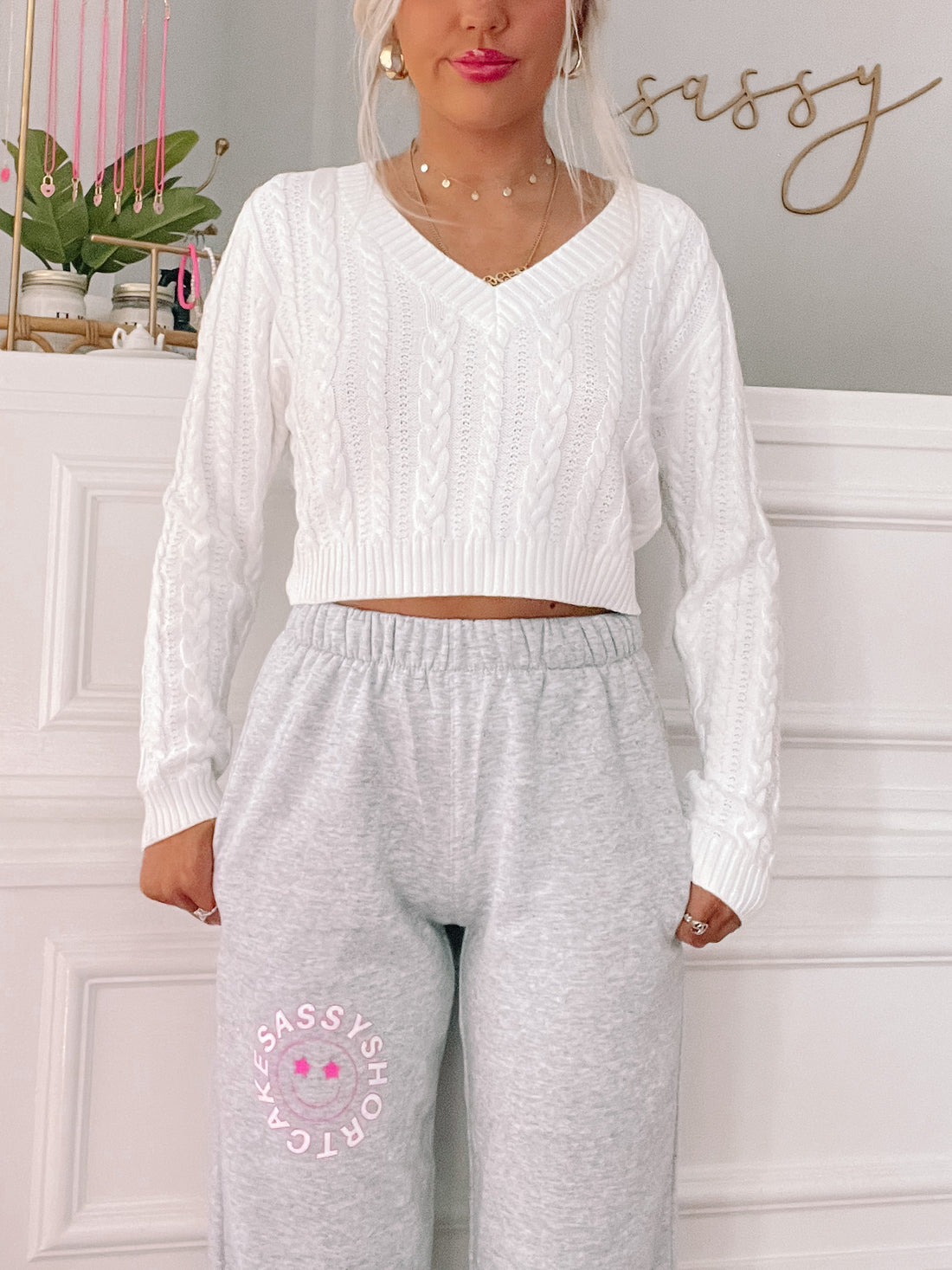 Gray Sassy Shortcake Smiley sweatpants with pink smiley face graphic
