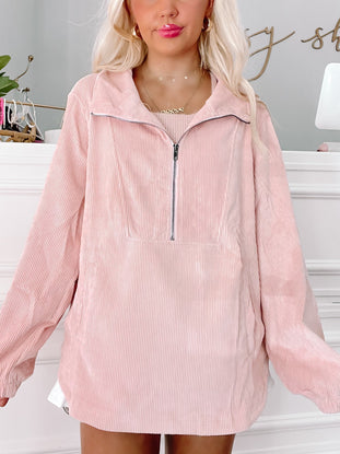 Pink corduroy half-zip jacket, relaxed fit, shown on model.

