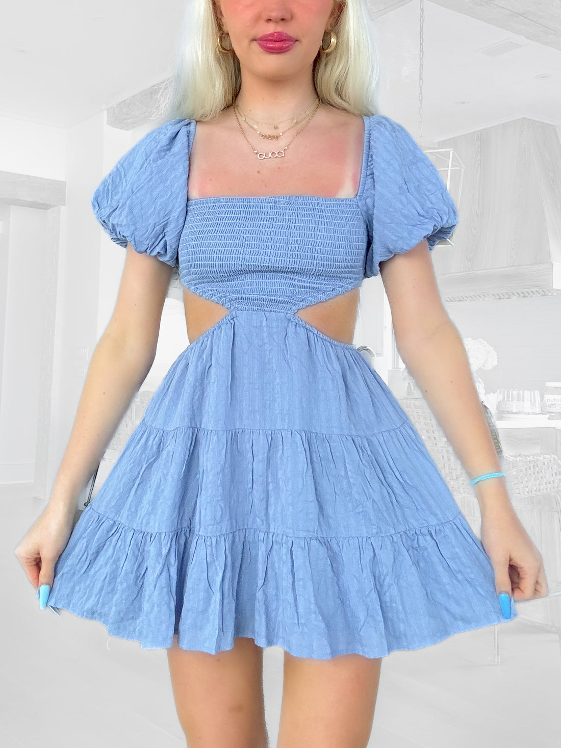 Clementine Cutie Dress in slate blue: tiered mini dress with puff sleeves and cutout detail.
