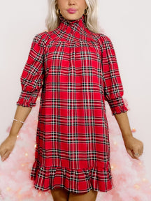 Red and black plaid party dress with mock neck and ruffle hem
