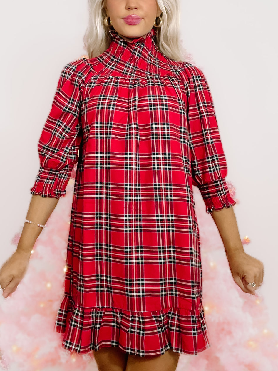 Red and black plaid party dress with mock neck and ruffle hem

