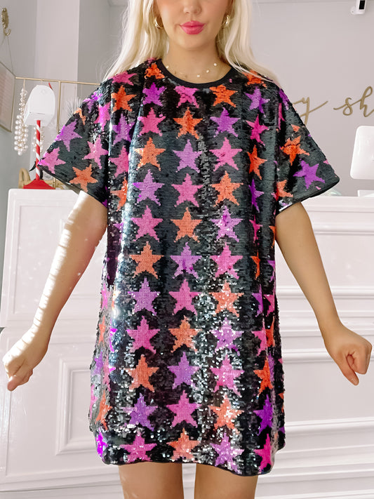 Stars Till Mars sequined mini dress with pink, purple, and orange stars on black.
