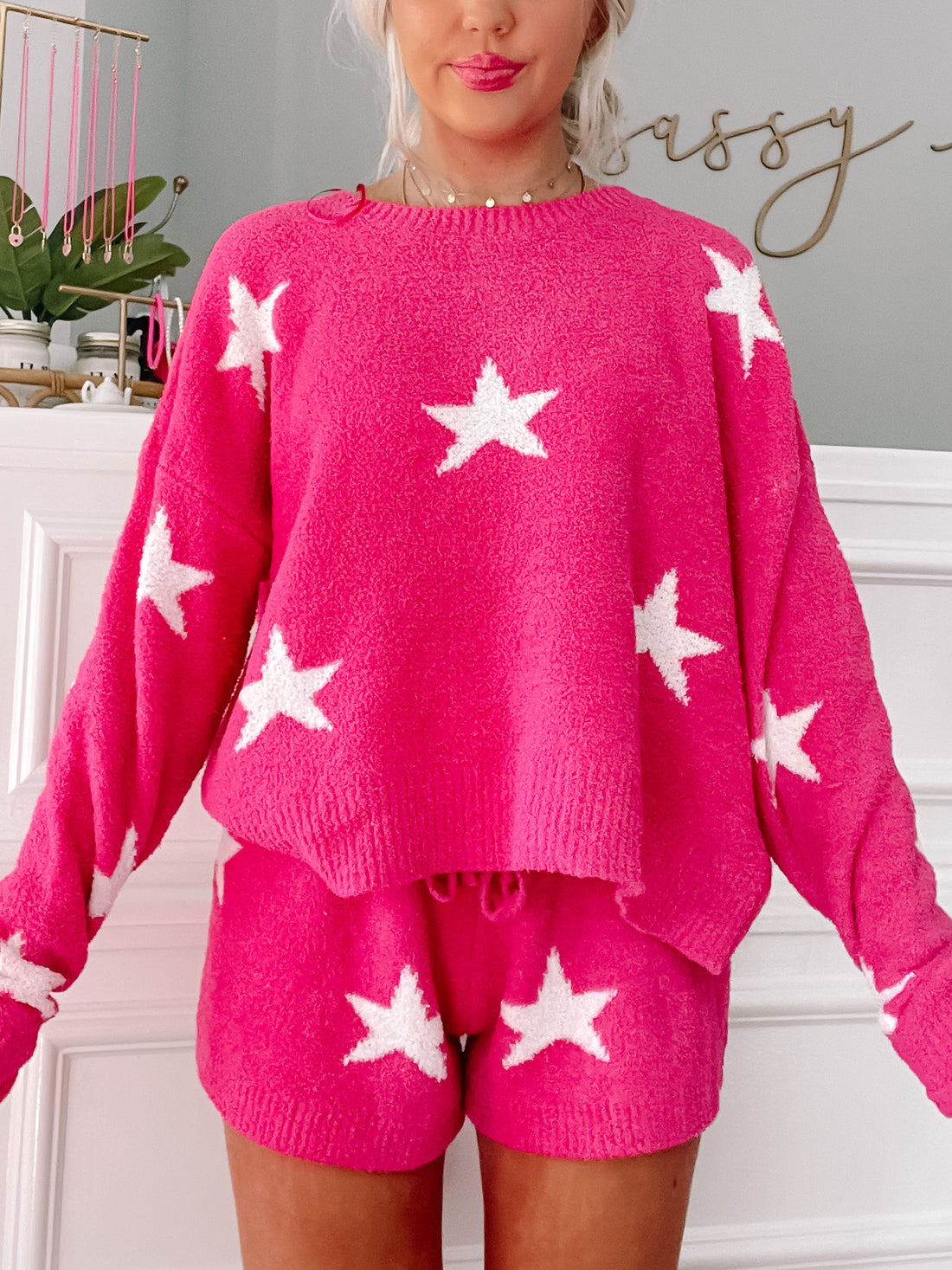 Hot pink sweater and shorts lounge set; fuzzy knit fabric with white star accents.
